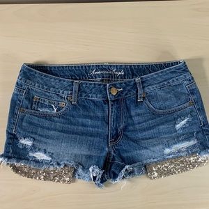 American Eagle - distressed shorts with sequin pockets visible - size 12